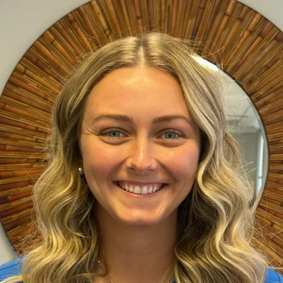 intern Keelee King Smiling In Office