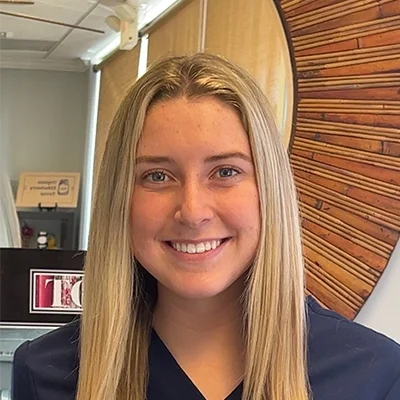 Staff Member Anna Whitaker Smiling In Office