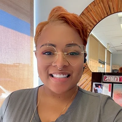 Staff Member Jackee Williams Smiling In Office