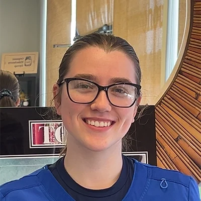 Staff Member Ryleigh Campbell Smiling In Office